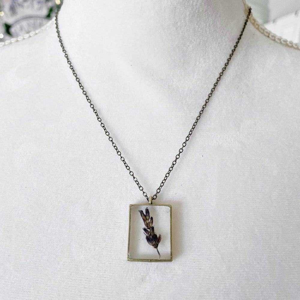 Purple lavender botanical resin necklace in silver bezel